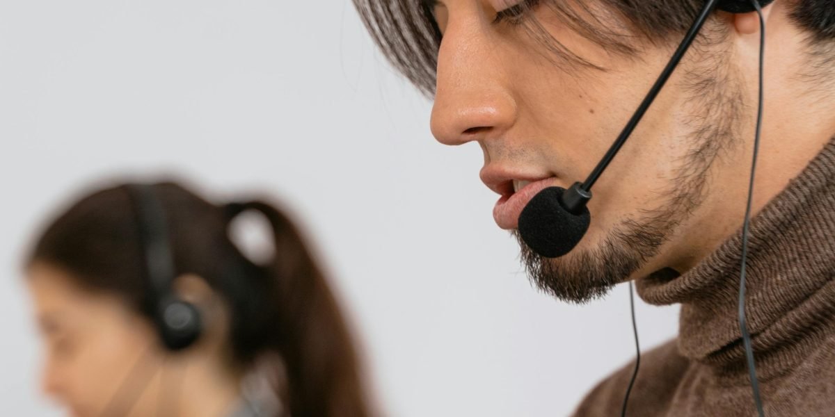 Someone engaged in a confidential conversation on the phone, reaching out for mental health support.