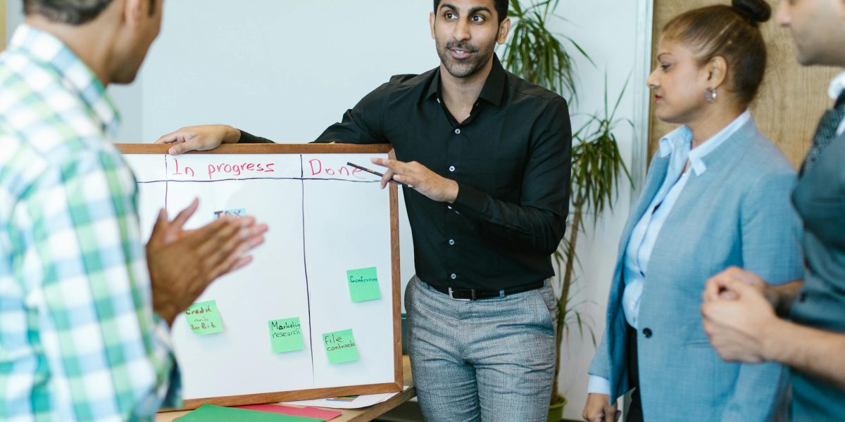 An individual presenting or leading a discussion to a group, promoting understanding and combating mental health stigma.