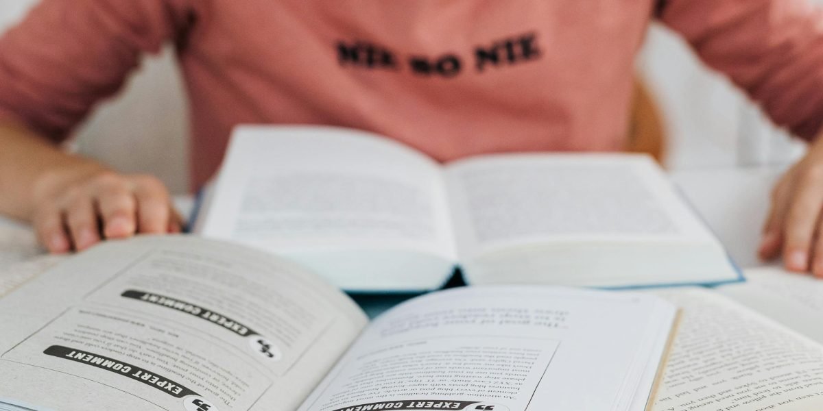 An individual deeply engaged in reading or studying, representing the effort to understand a complex mental health condition.