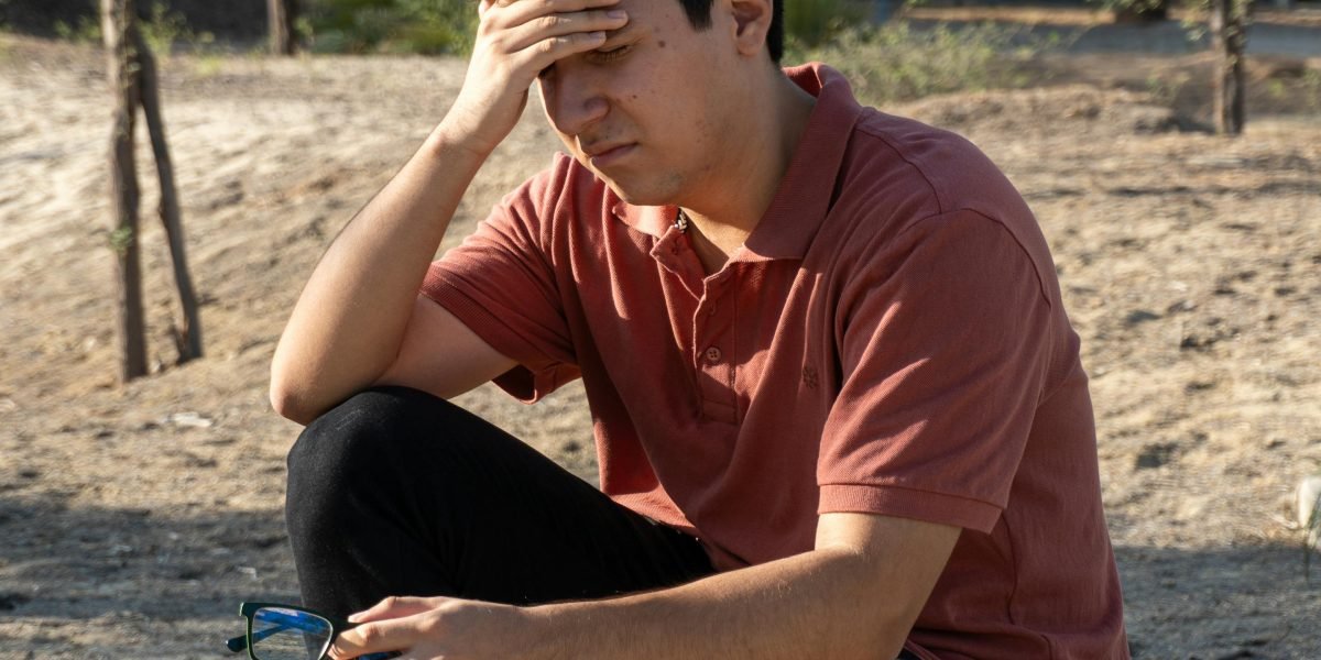 A person reflects, seeking clarity and understanding amid personal challenges.