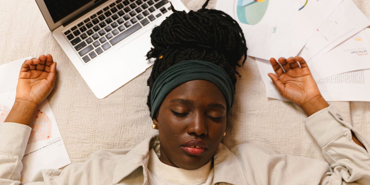 A counsellor feeling exhausted and overwhelmed, symbolizing burnout from emotional demands.