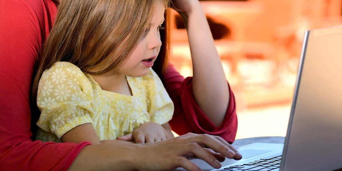 A parent and child engaged in a calm, positive interaction, demonstrating effective home strategies.