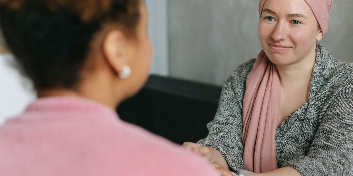 Two individuals engaged in a supportive and understanding conversation about sensitive topics, fostering trust and openness.