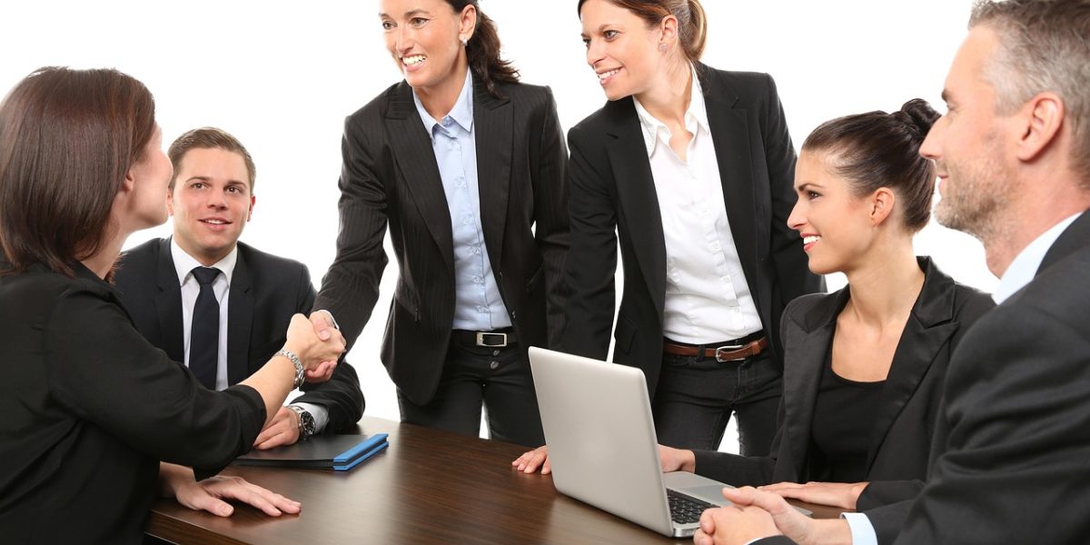 A team of mental health professionals and peer workers collaborating effectively.