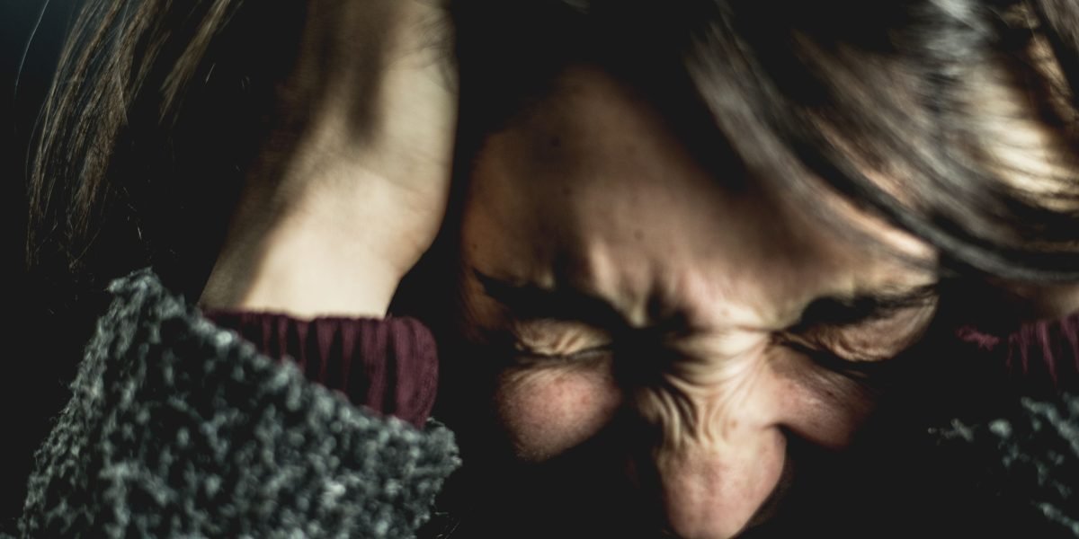 A person feeling overwhelmed, looking for clarity amidst many options for mental health support.