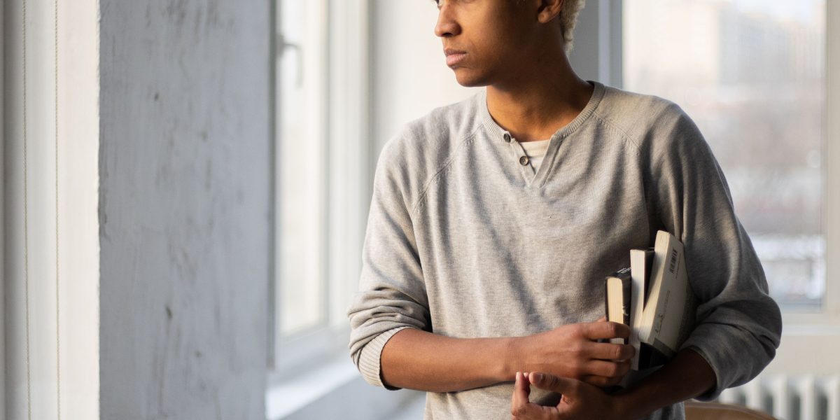 A person sitting thoughtfully, symbolizing the process of learning and understanding complex psychological topics.