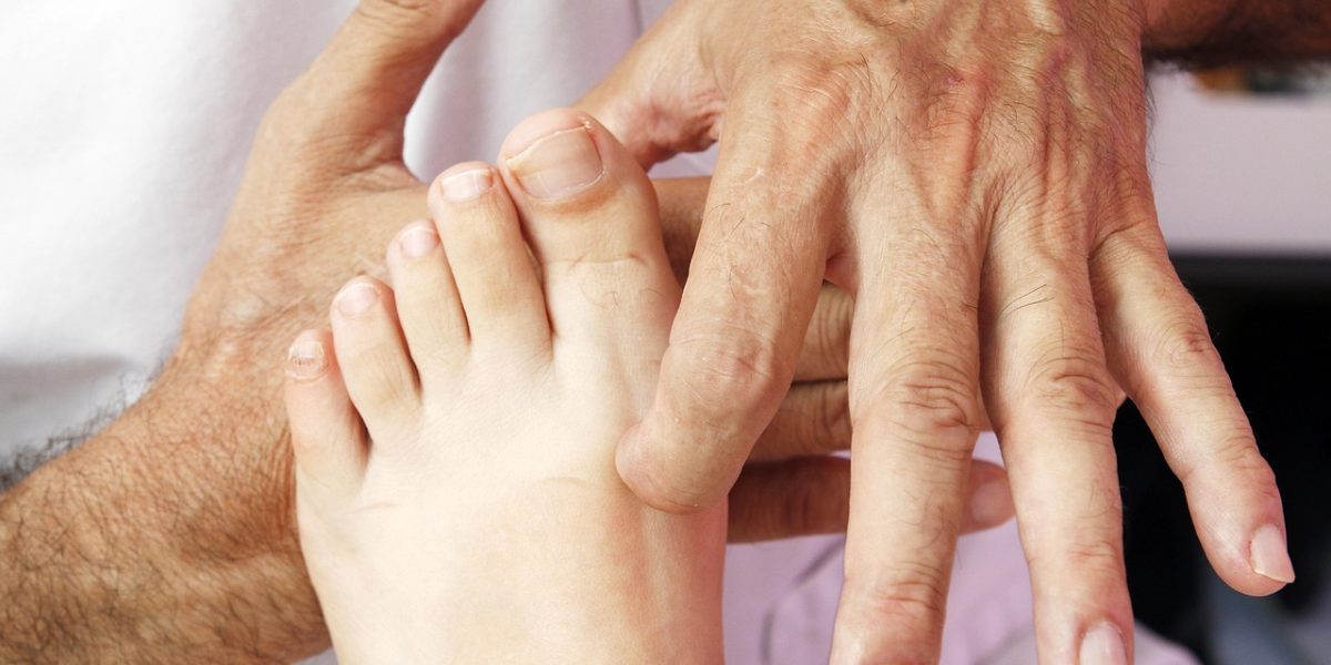 A therapist and client collaboratively reviewing progress charts or logs in a therapy session.
