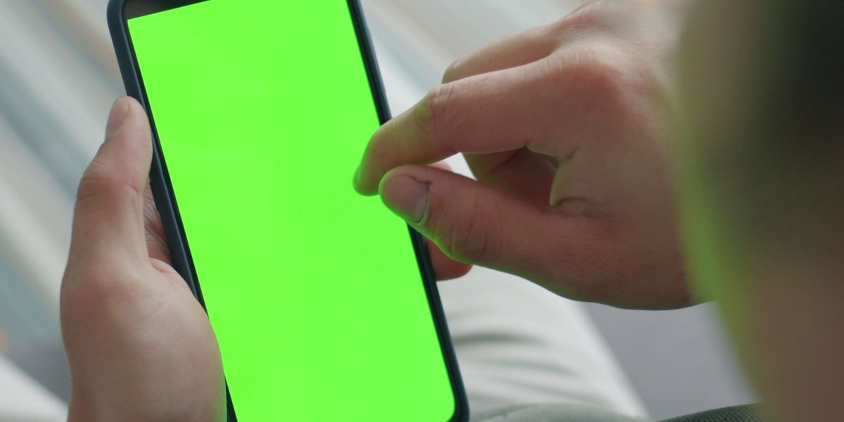 A person using a smartphone app, symbolizing modern technological innovations in mental health treatment.