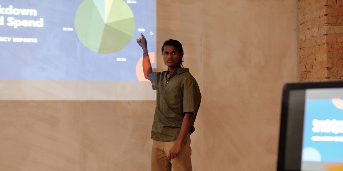 A person presenting information with confidence, representing the importance of accurate terminology in mental health discussions.