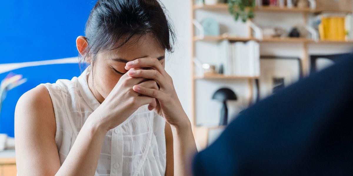 A person thoughtfully considering different therapeutic paths and options for mental health support.