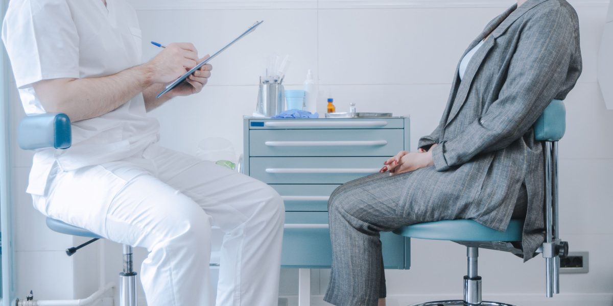 A therapy professional and a patient collaboratively discussing a holistic and integrated treatment strategy.
