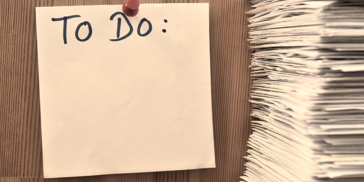 Someone using a checklist to evaluate mental health tools, emphasizing careful selection.